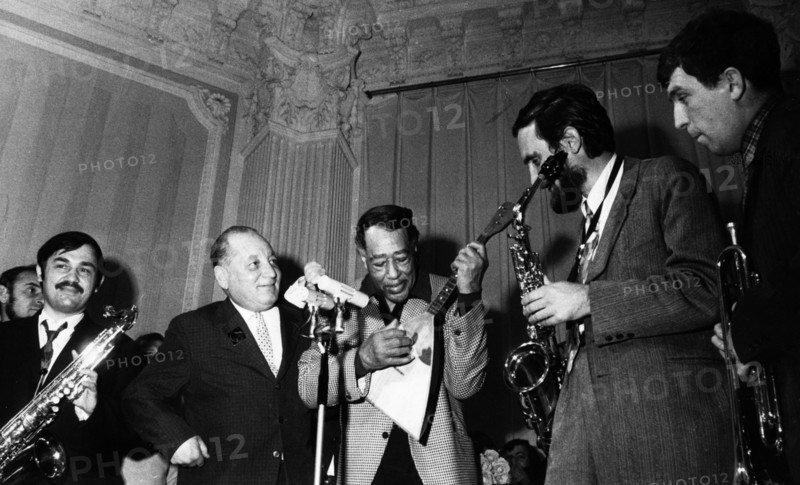 American composer duke ellington playing a russian balalaika that was given to him as a gift, to his right is the soviet composer sigizmund katz, october 13, 1971.