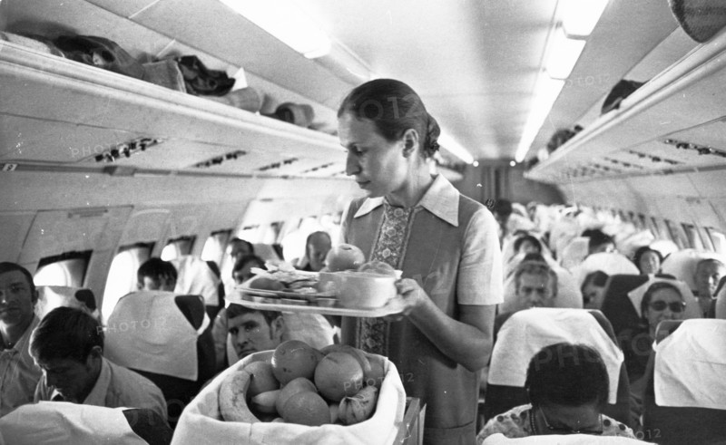 Pasengers being served during an aeroflot flight to tokyo, september 1973.