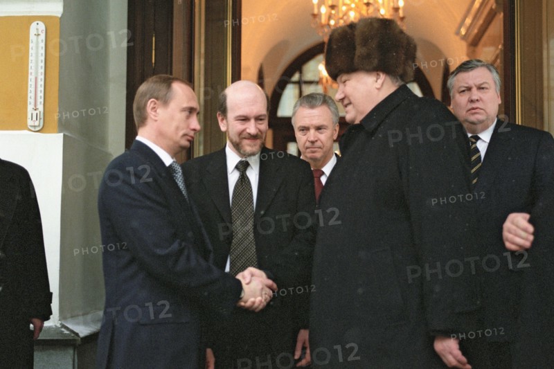 Moscow, russia, outgoing russian president boris yeltsin (r) shaking hands with russian prime minister and acting president vladimir putin (l) as he leaves moscow's kremlin, the seat of russian power,1999.