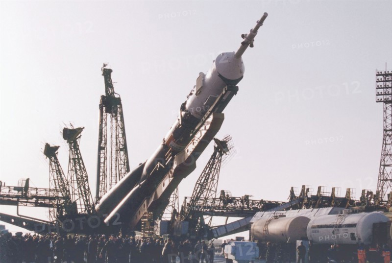 Baikonur, kazakhstan , april 26, 2001, a souyz tm-32 spacecraft with a booster-rocket pictured being erected at a launching site of baikonur cosmodrome on thursday , the launch of a russian crew and the world's first ever space tourist dennis tito, is scheduled on april 28.