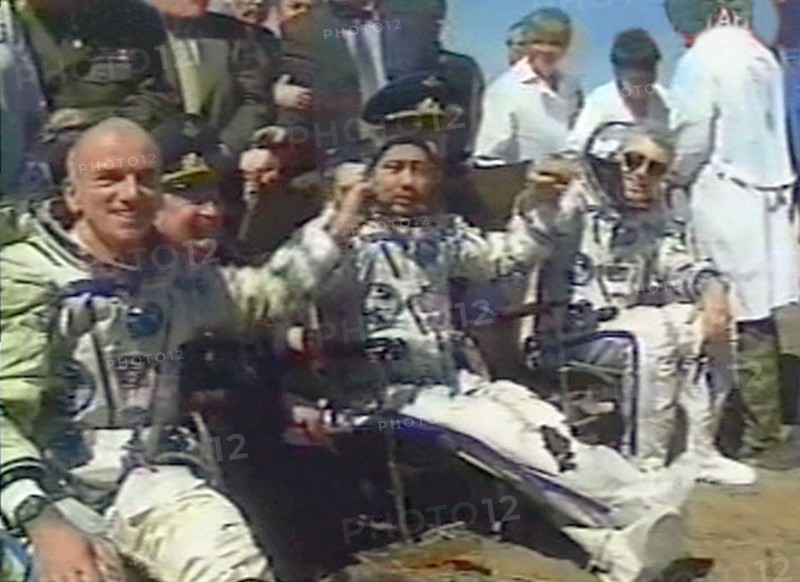 May 6, 2001, american multimillionaire dennis tito, 60, (left) following an eight-day space flight which cost him 20 million dollars, safely returned on sunday to earth together with his russian crewmates -- talgat musabayev (centre) and yuri baturin (right), their descent capsule touched down in kazakhstan at 09:41 moscow time near the city of arkalyk,the crew members feel themselves so well that they asked a permission to get out of the descent capsule on their own.