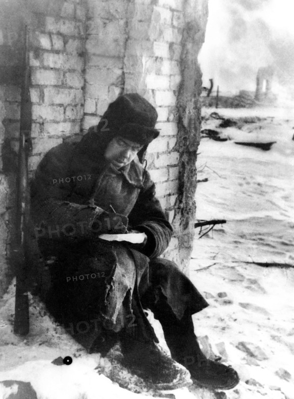 Battle of stalingrad, 1943, a red army soldier writing a letter home.