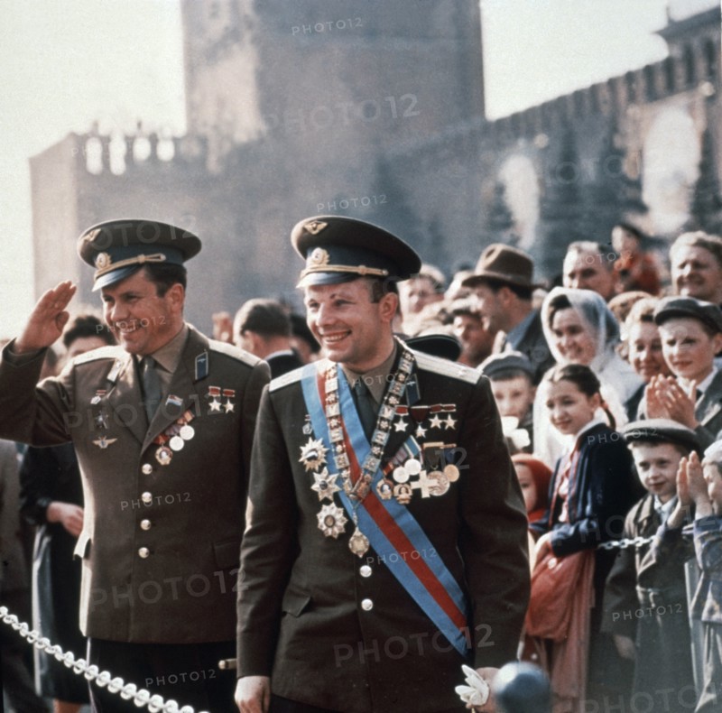Soviet cosmonauts yuri gagarin (right) and pavel popovich greet admiring moscow crowd in red square, moscow, ussr 1963.