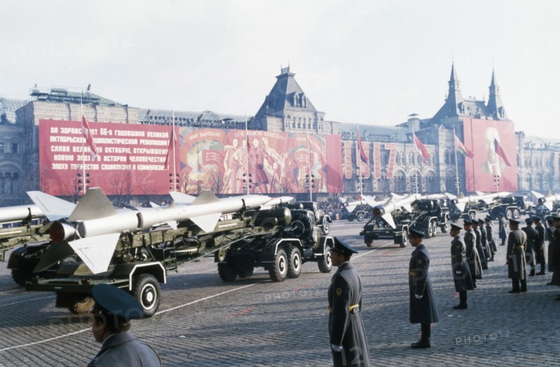 Trucks bearing sa-2 surface-to-air missiles at a military parade in red square celebrating the 66th anniversary of the great october socialist revolution, november 7, 1983, moscow, ussr.