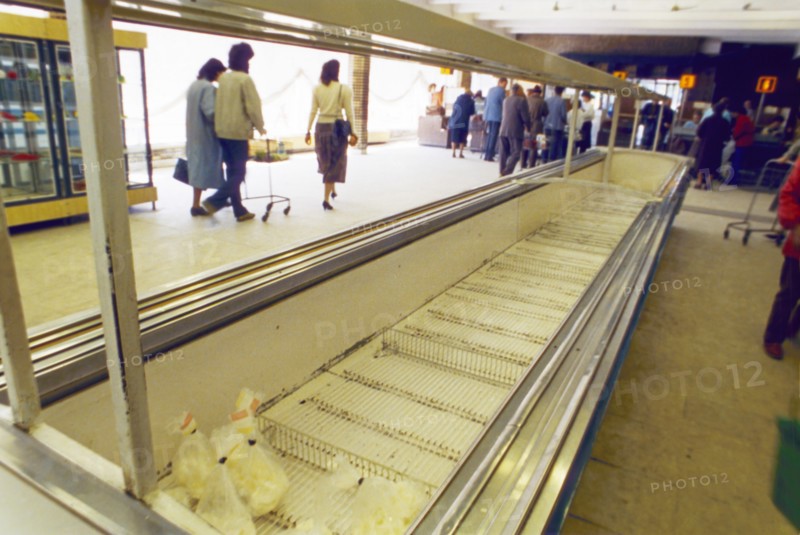 Empty meat cases at grocery store n4 in moscow, restrictions on the sale of food and consumer goods to non-muscovites, imposed by the capital's new authorities, hasn't done much to increase the selection, ussr, may 1990.