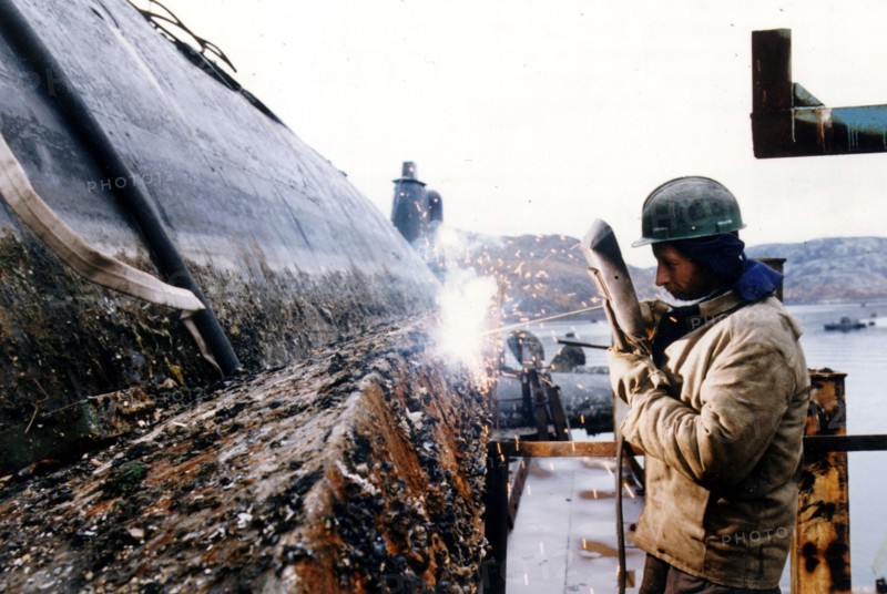Russia, murmansk region, november 27, 1997, despite the crisis with financing of the conversion programme ship repair works 'nerpa' continues utilizing old written off submarines, a submarine discharged from the list of northern fleet combat ships being cut to pieces.