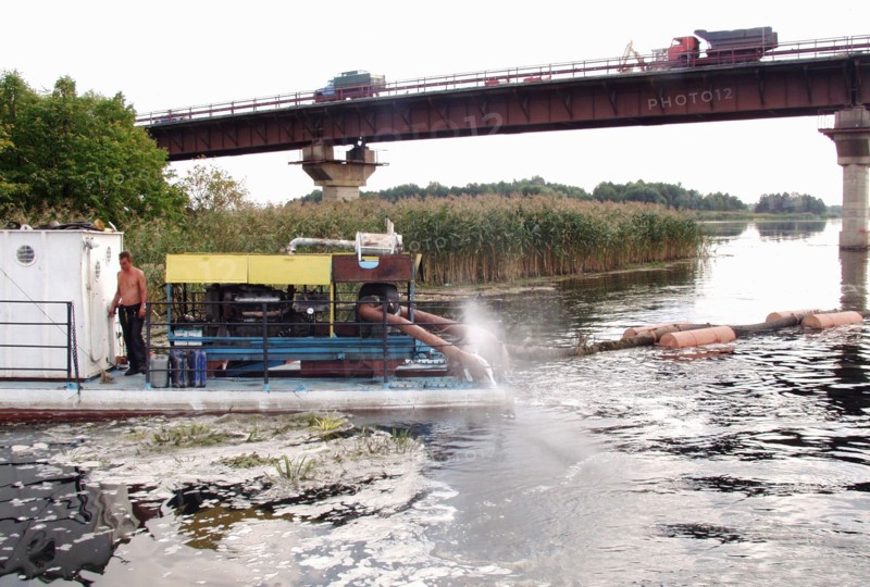 Russia, voronezh region, piles of the bridge across the voronezh river located at the 500th kilometre of the 'don'' federal highway are strengthened by sand, october 14, 2004.