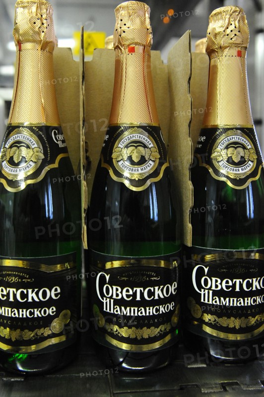 Moscow, russia, november 29, 2010, bottles of sovetskoye shampanskoye being packed in boxes at kornet, a moscow-based champagne winery.