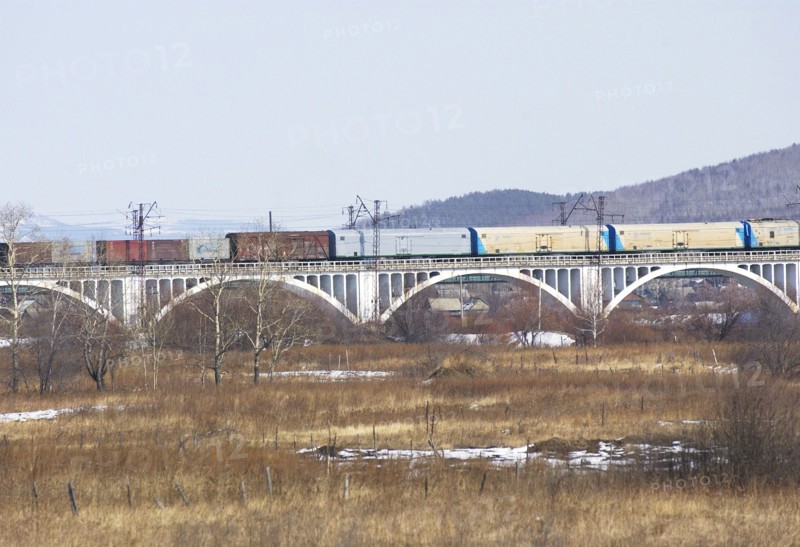 Amur region, russia, the picture shows a railway bridge at the skovorodino railway station along the trans-siberian railway, april 2006.
