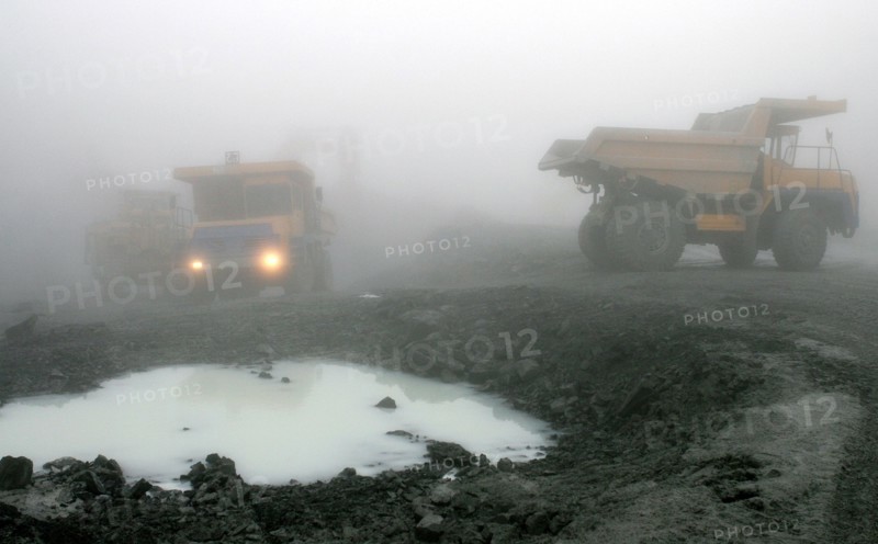 Oao 'kongor-chrom' mines, mining of chromium ore in the ural region of russia, belaz dump trucks, september 2006.