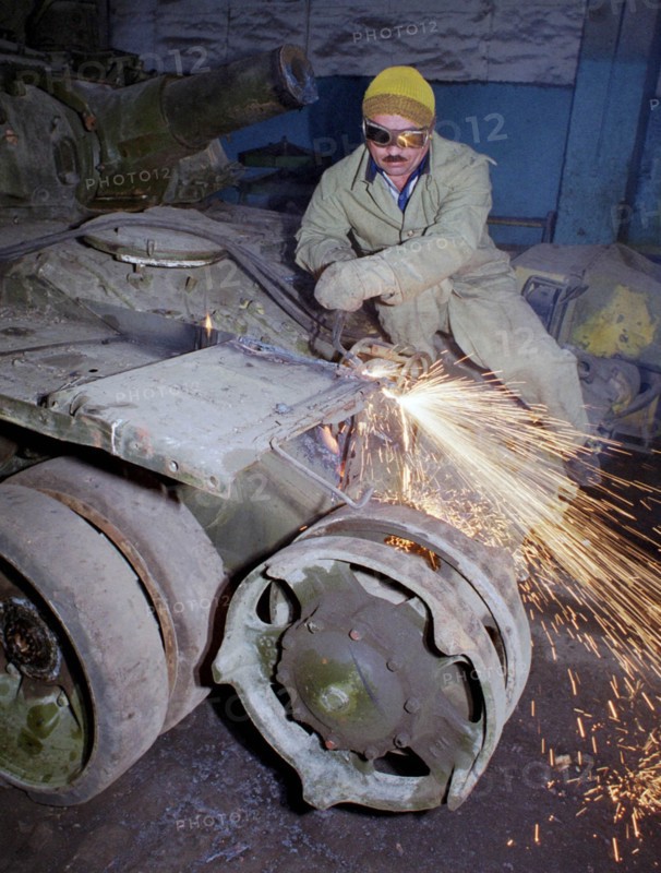 Welder sabir gadzhiyev cuts into pieces a soviet-made t-72 tank which is an item of obsolete military hardware subject to elimination under the treaty on conventional armed forces in europe, the first stage of scrapping of russian military hardware started sept,10 at the armored repair works of the grouping of russian troops in transcaucasia, tbilisi, georgia, september 10 2000.