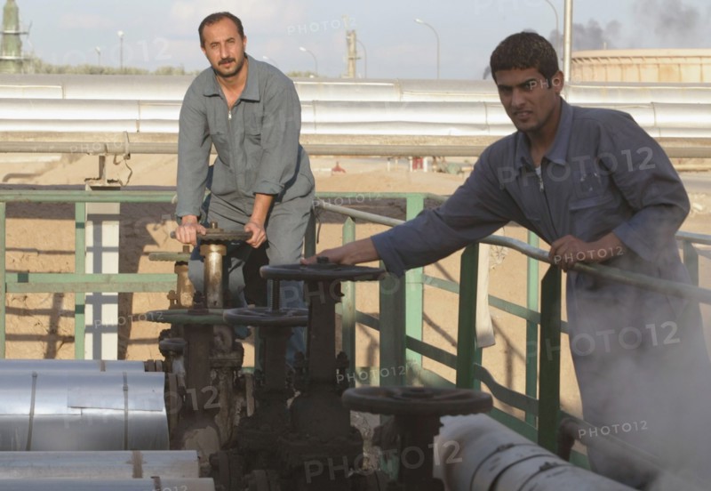Baghdad, iraq 2/03: workers at oil refinery on the outskirts of the city.