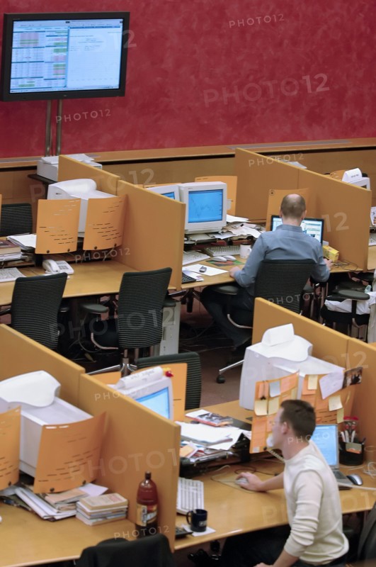 Brokers are pictured at their computers in the trading room at the moscow interbank currency exchange (micex), moscow, russia, 2006.