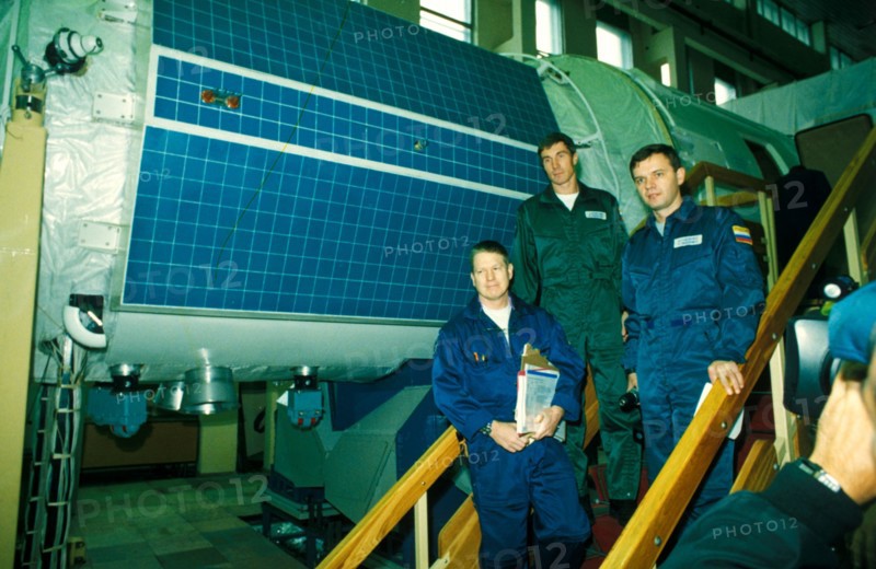International space station, first long-term crew, from left: shephard, krikalev and gidzenko with zvezda service module, 10/00.