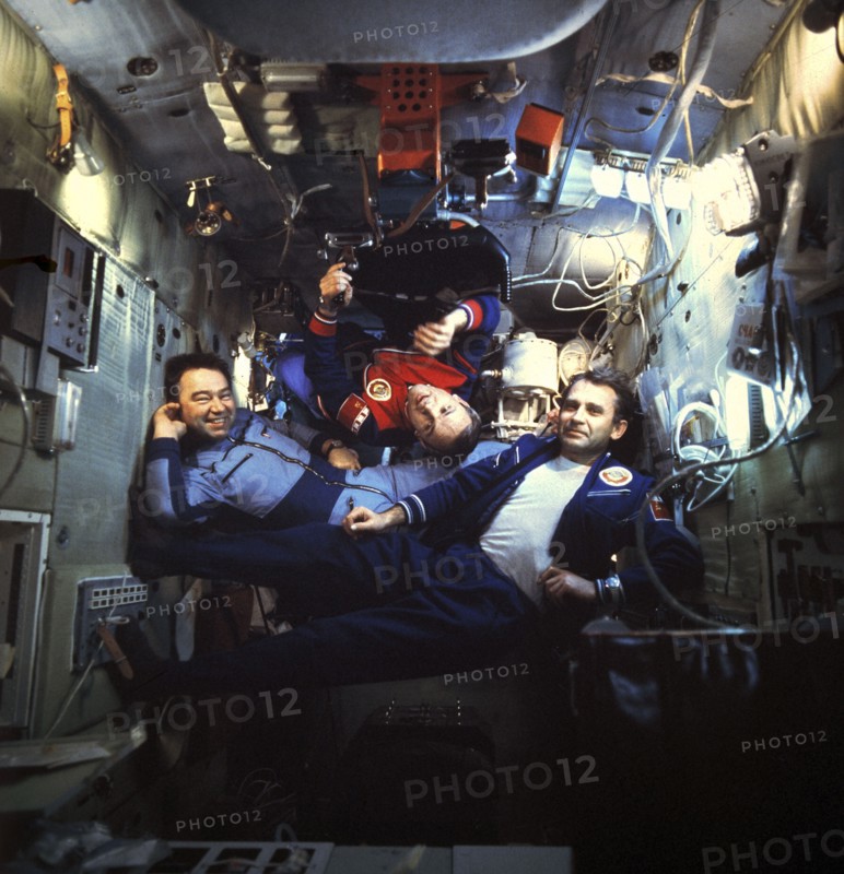 Soviet cosmonauts georgi grechko, vladimir dzhanibekov, and oleg makarov aboard the salyut 6 space station, docked with soyuz 26 and 27, 1978.