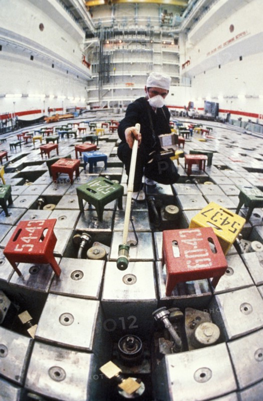 Technician in one of the reactors of the chernobyl nuclear power plant testing for high levels of radiation after the accident in april of 1986, may 1986.