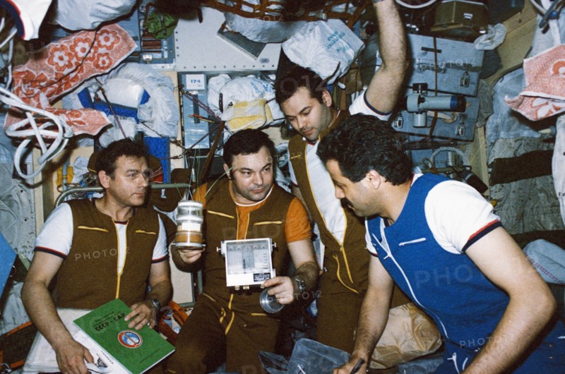 Mir, soyuz tm-2, soyuz tm-3, cosmonauts aleksandr laveykin, yuri romanenko, and muhammed faris (syria) with objects for biological research, 1987.