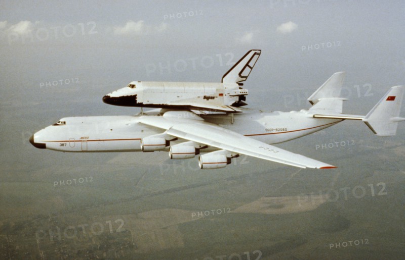The antonov-225 mriya super-heavy transport aircraft conducting its first flight carrying the soviet space shuttle, buran, may 1989.