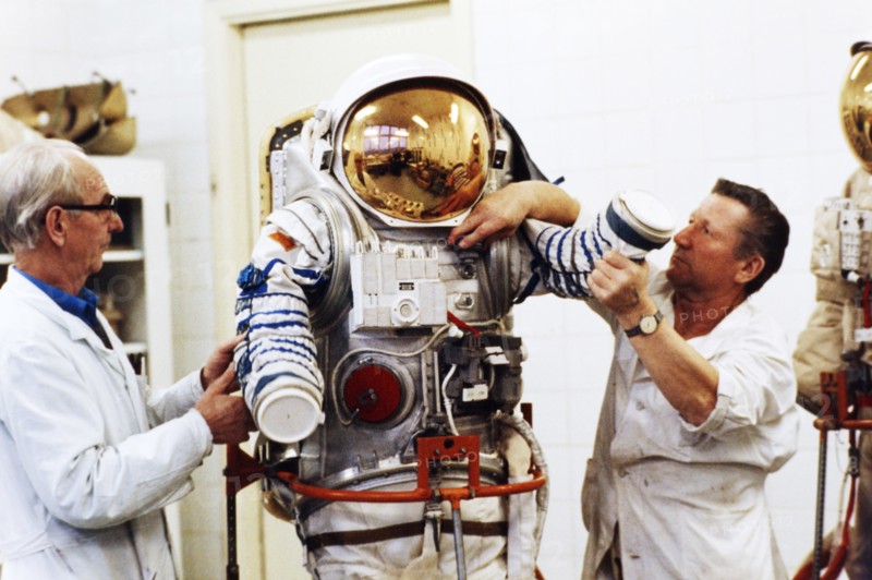 Assemblers at a recently de-classified aerospace facility ivan volchenkov and nikolay petrov with one of several newly designed spacesuits to be delivered to the mir space station, 1992.