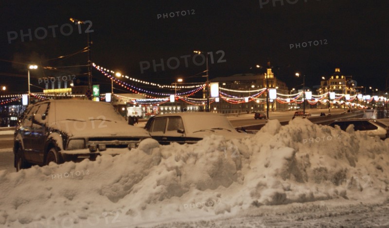 Moscow,russia, december 8, 2003,snow-ploughs clean moscow streets as the heavy snowfall that hit moscow made the road traffic difficult here.