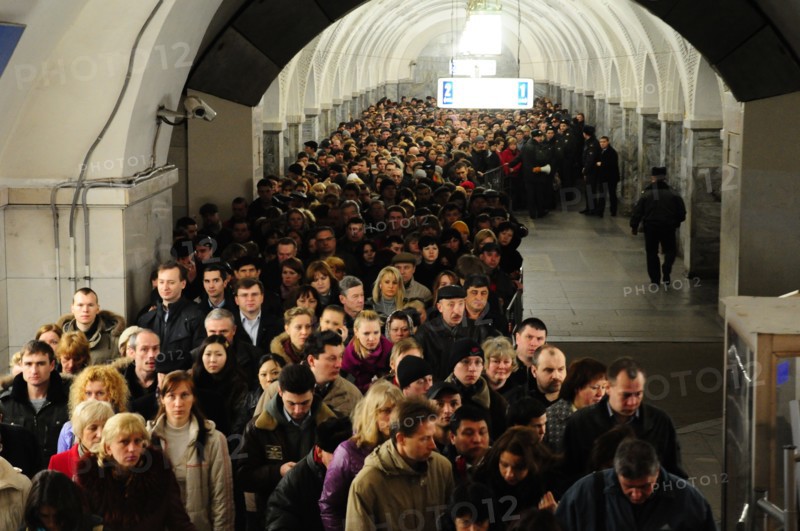 Moscow, russia, march 29, 2010, crowds of commuters walk past a sealed-off area in park kultury metro station, sokolnicheskaya line of the moscow underground, an explosion rocked the metro station at 8,40 during the rush hour killing more than ten passengers.