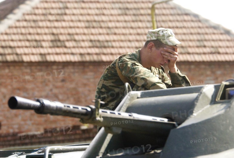 Beslan (north ossetia), russia, september 2, 2004, servicemen on guard around the building of the school no 1 in the city beslan seized by terrorists.