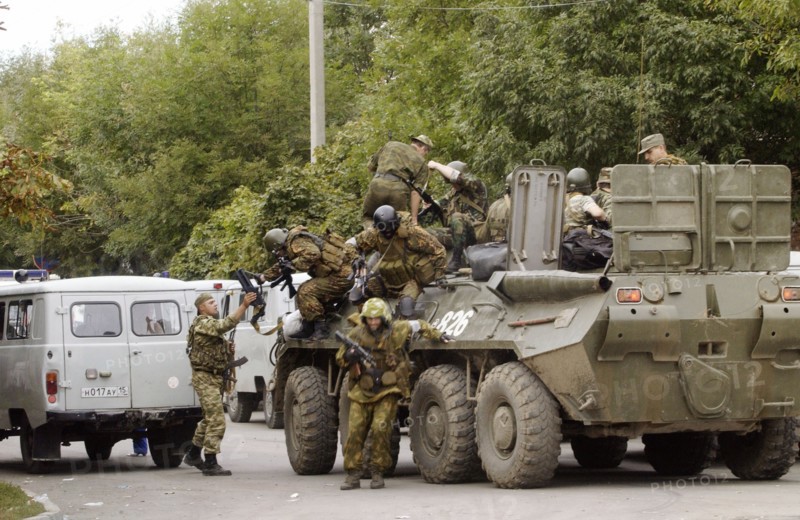 Special forces soldiers take position at a seized school in beslan, north ossetia, friday, sept, 3, 2004.