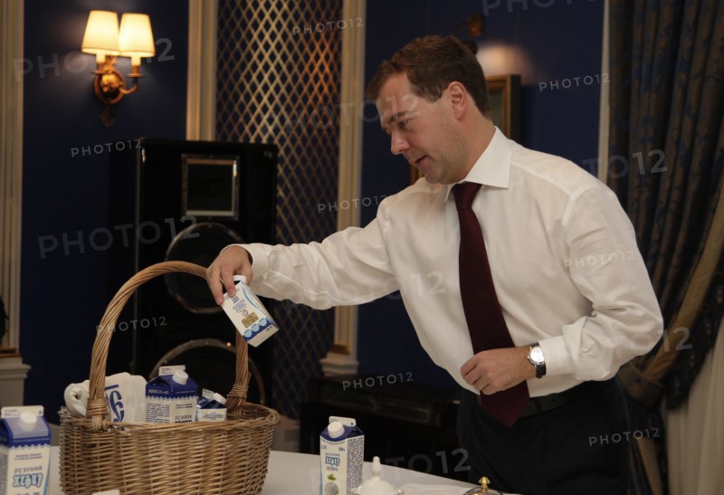 Moscow region, russia, october 1, 2010, president of russia dmitry medvedev with milk products from ruzskoye moloko dairy company during his meeting with pm putin at gorki residence.