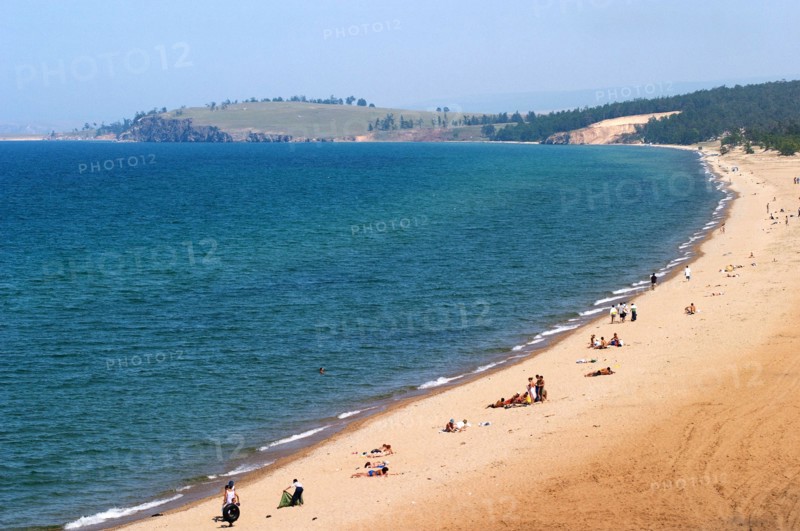 Irkutsk region, russia, holiday-makers on the beach on olkhon island, lake baikal, in summer, august 2005.