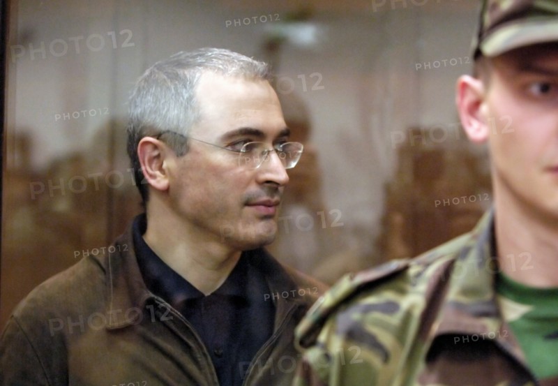 Moscow, russia, september 22, former head of yukos mikhail khodorkovsky leaves the courtroom after hearing that the moscow city court has reduced his and p, lebedev's sentences from 9 to 8 years of imprisonment.