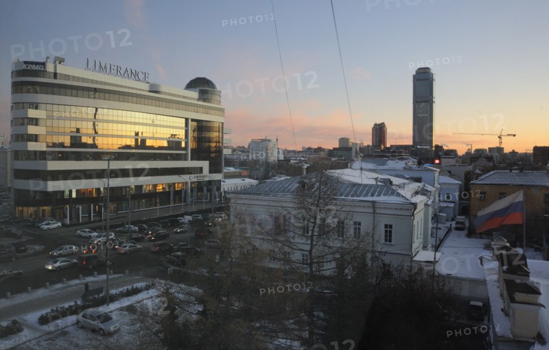 Yekaterinburg, russia, november 28, 2011, night view of vysotsky business centre, a 54 storey skyscraper (far) and 'limerence' shopping center (l).