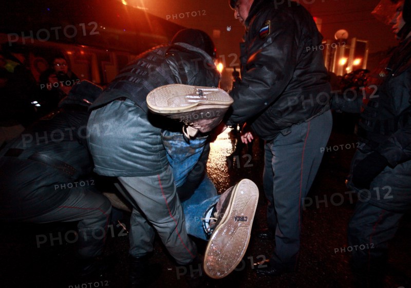 Moscow, russia, december 5, 2011, police detain demonstrators during an opposition protest in central moscow against alleged vote-rigging in the december 4 parliamentary election.