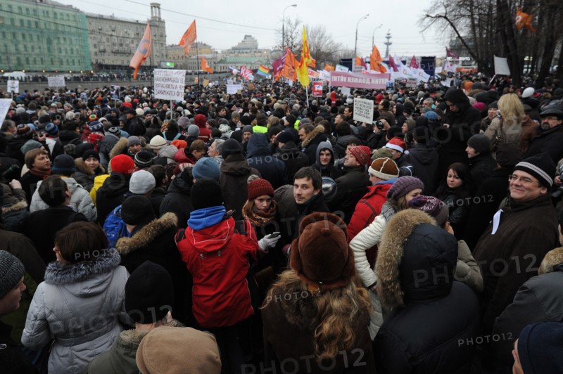 Moscow, russia, december 10, 2011, people attend an authorized rally 'for honest elections' in moscow's bolotnaya square to protest against electoral fraud at recent elections to the state duma.