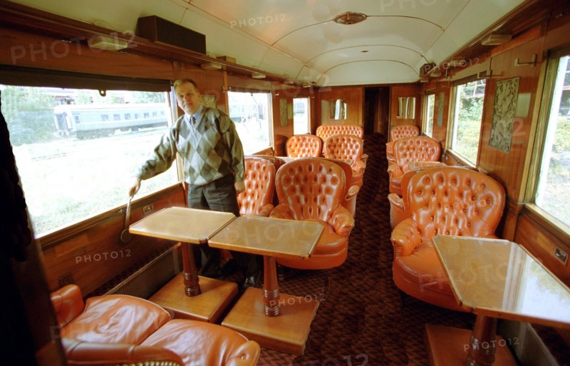 Vologda, russia, september 14, 2002, alexander kononov examines the interior of one of the buffet cars of 'the orient express'
