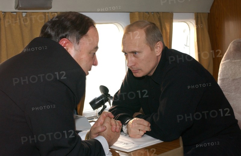 Russia, november 5, president vladimir putin (r) and adygeya head khazret sovmen talking on board a plane on tuesday, when the russian head of state inspected the reconstruction of housing in the flood-stricken districts of the stavropol and krasnodar territores and the adyghe republic.