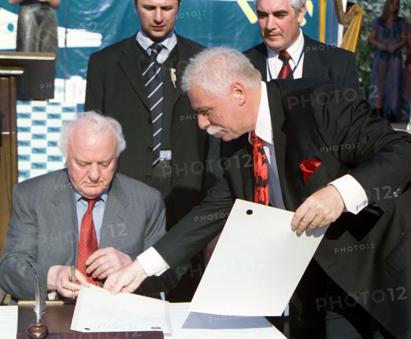 Georgia, august 21, 2003, georgian president eduard shevardnadze (l) and well-known businessman badri patarkatsishvili (r) signed documents on the beginning of construction a health resort 'imedis kalaki '(town of hope) located between the cities of poti and batumi , the construction will be financed by patarkatsishvili.