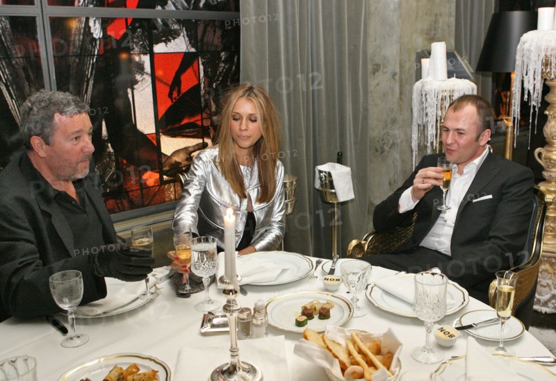 French designer philippe patrick starck (l) is seen at his newly-launched restaurant bon in moscow, pictured at right are andrei melnichenko (r), chairman of the board, mdm bank, and his spouse, moscow, russia, april 2006.
