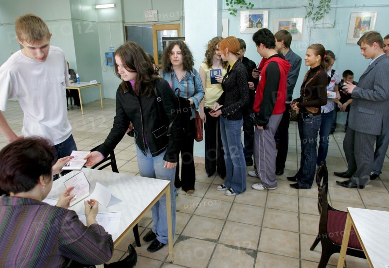 Checking high school students present ids before the single state exam in social studies at a moscow school, moscow, russia, may 23, 2006.