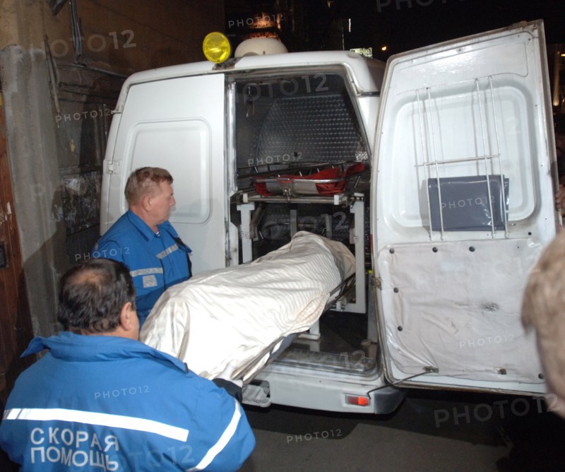 Moscow, russia, october 7, 2006, members of a rescue crew carry out the body of journalist anna politkovskaya, the novaya gazeta special correspondent anna politkovskaya was found shot dead in the hallway of the building where she lived in the centre of the russian capital.