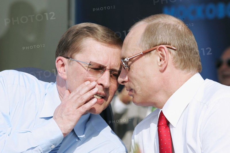 Russian first deputy prime minister sergei ivanov (l) and russian president vladimir putin talk at the opening ceremony of the 8th international aviation & space salon maks 2007  in the town of zhukovsky, moscow region of russia, august 17, 2007.