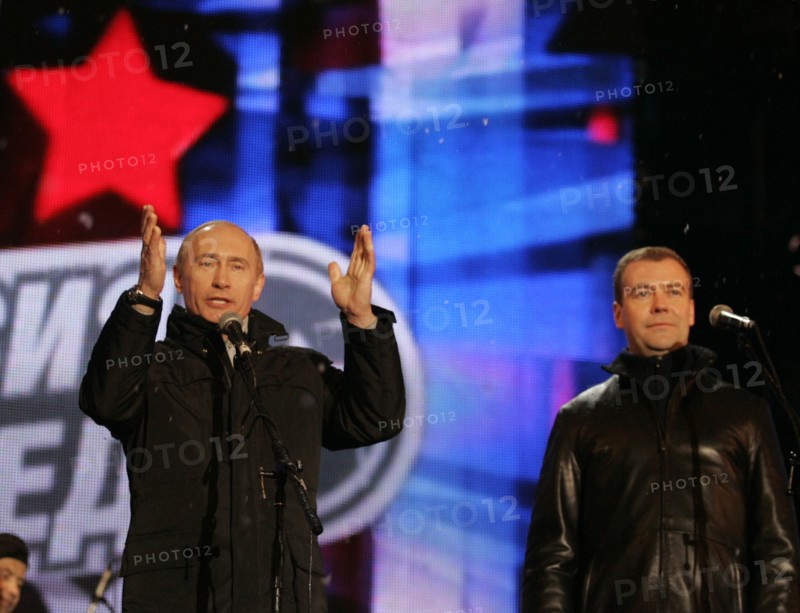 Moscow, russia, march 2, 2008, outgoing president vladimir putin (l) and first deputy prime minister dmitry medvedev address the audience during a concert in vasilyevsky spusk off red square, marking the outcome of the 2008 presidential election.