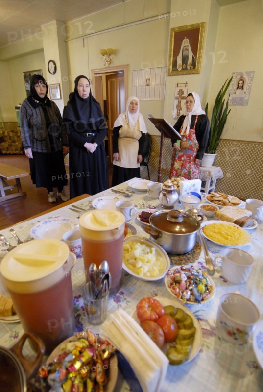 Nuns are praying before having meagre dinner in a frater of the nativity of the holy virgin cathedral in chernogorsk during the lent,  krasnoyarsk territory, russia, march 20, 2008.