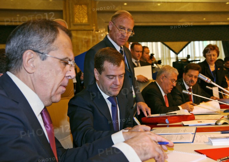 Foreign minister sergei lavrov (foreground) and president of russia dmitry medvedev (background) appear prior to the meeting of the council of the heads of state of the commonwealth of independent states (cis) member countries which is opened at a congress hall of the state residence ala archa, in the capital of kyrgyzstan, bishkek, october 10, 2008.