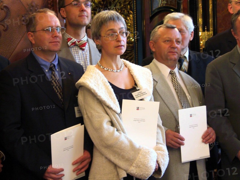 Novaya gazeta journalist anna politkovskaya (c) and her colleagues from belarus and ukraine being presented with gerd bucerius award entitled 'die junge presse in ost-europa' [young press in eastern europe] by the foundation 'zeit-stiftung ebelin und gerd bucerius', in hamburg, germany, june 3, 2002.