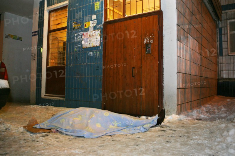 Moscow, russia, february 5, 2009, body of former deputy mayor of grozny gilani shepiyev, gunned down at the entrance to his home in western moscow, seen at the site of the murder.