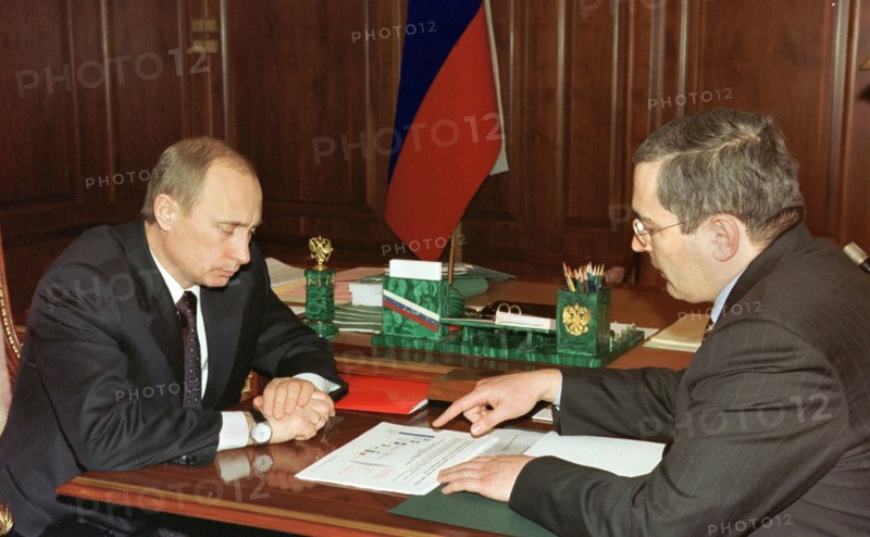 President vladimir putin (l) pictured during the meeting with board chairman of the yukos oil company mikhail khodorkovsky in the kremlin on friday, december 20, 2002.