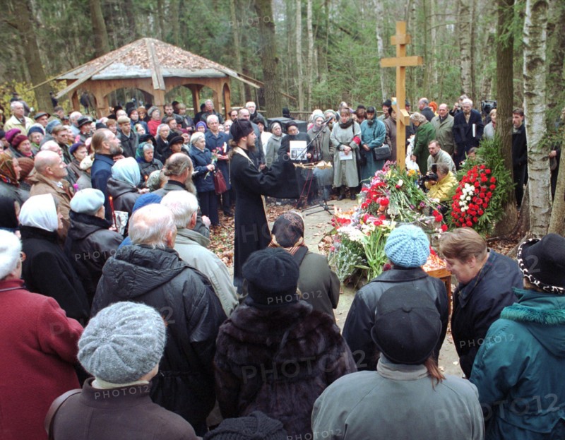 Moscow, russia, october 29, 2000, people holding burning candles attend a mourning service to commemorate the vistims of stalinist repressions on the territory of the former datcha(summer house) of genrikh yagoda, soviet secret police chief, the action was held on the eve of the day of victims of repressions.