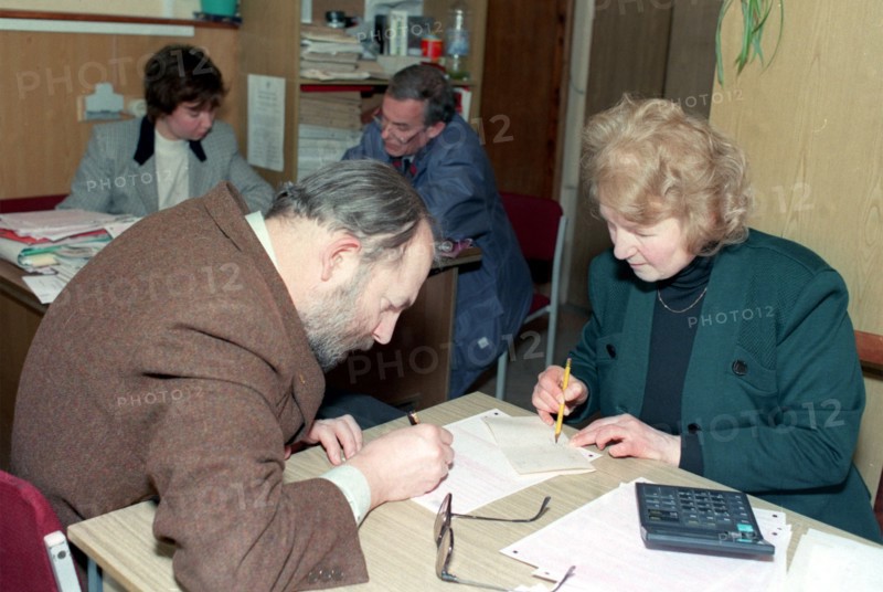 Russian tax payer with a federal tax inspector, moscow, russia, march 2002.