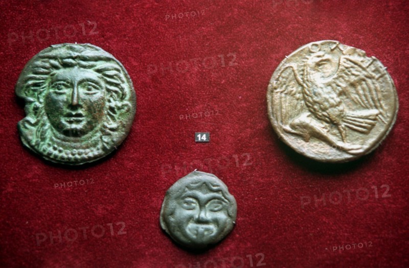Moscow, russia, 02,99, bronze coins of the 4th century b,c, found in the northern regions of the black sea shore are displayed at the exhibition of the greek and roman coins of the vi-iv c, b,c, opened in the state museum of fine arts named after pushkin in downtown moscow on tuesday , over 1500 different exhibits acquainting with history, economy,culture and religion of ancient greece and rome are displayed at exposition.