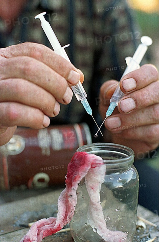 Orenburg, russia, 2001, the sharing of syringes (needles) by drug addicts is a leading cause of the spread of aids.
